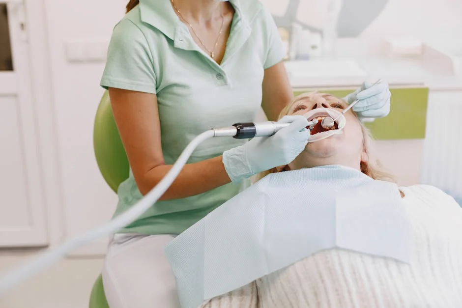 Dentist performing an oral examination on a patient in a clinic setting.